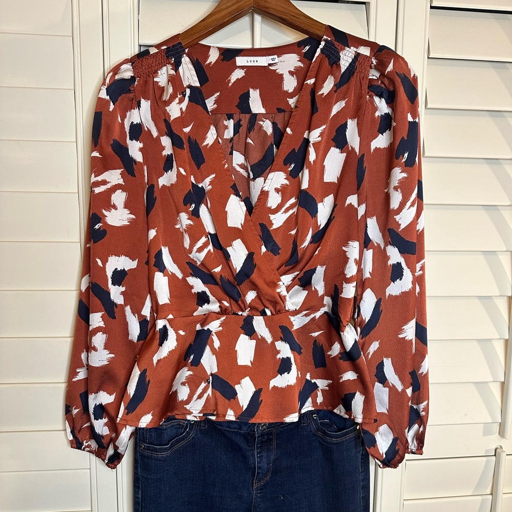 Lush rust and navy peplum silky top
